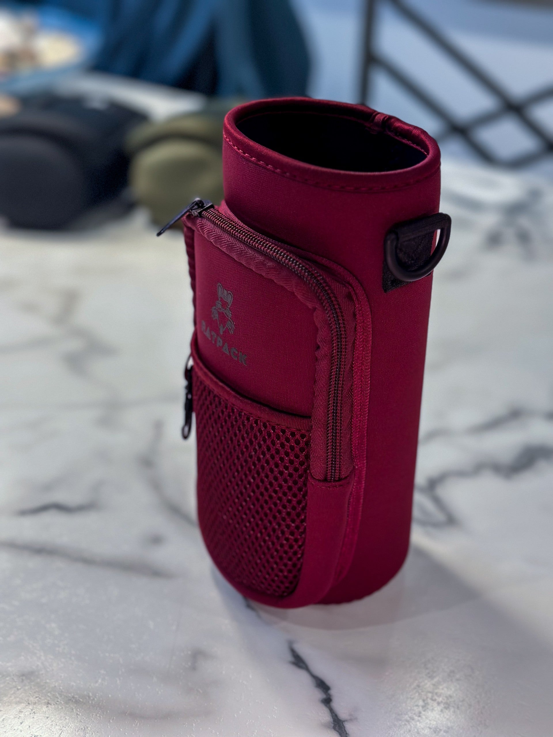 40 ounce/ 1.3 Liter water bottle sleeve insulated cross body carrier with pockets for phone and essentials, built in key chain burgundy